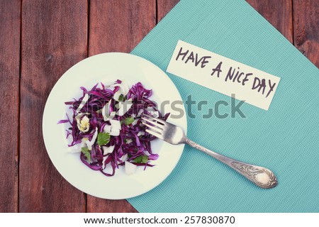 Cabbage salad on a plate. Red cabbage and Chinese cabbage on a plate. Top view. Tinted photo. Concept of healthy food. Have a nice day. Note, banner, space for text.