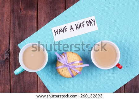 Two cups of coffee on the table. Coffee with milk on the table. Morning coffee for two. Cookies on the table. Top view. Have a nice day. Cheerful romantic morning.