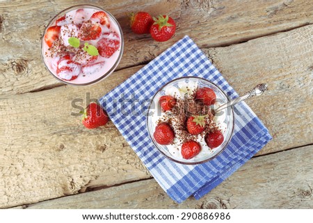 Dessert with strawberries and yogurt. Chocolate, yogurt and pieces of strawberries. Harvest of strawberries. Strawberries with sour cream and chocolates. Strawberries with yogurt.
