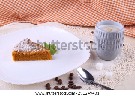 A Cup of cappuccino and a piece of cake. Delicious carrot cake and a Cup of coffee. Morning coffee and cake. Coffee with milk and dessert. Good morning. Cup of coffee and a piece of carrot cake.