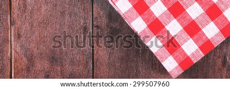Banner background. Wooden table and a corner table cloth. Red and white checkered tablecloth. Site header. The element of web design.