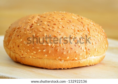 Burger bread on a wooden kitchen board