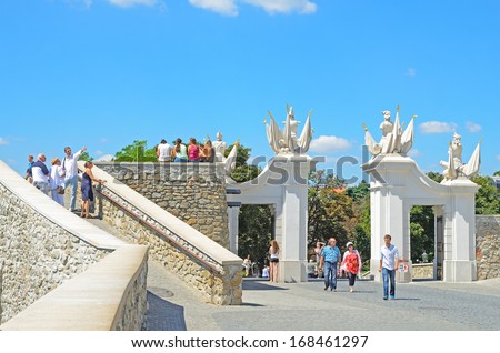BRATISLAVA, SLOVAKIA - AUGUST 1: Tourists visit gate of Bratislava Castle on August 1, 2013 in Bratislava, Slovakia. Castle is the symbol of Bratislava, been built on a hill. First written reference from 907.