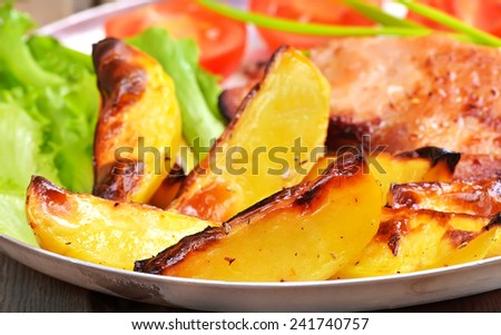 Fried potato wedges, close up view