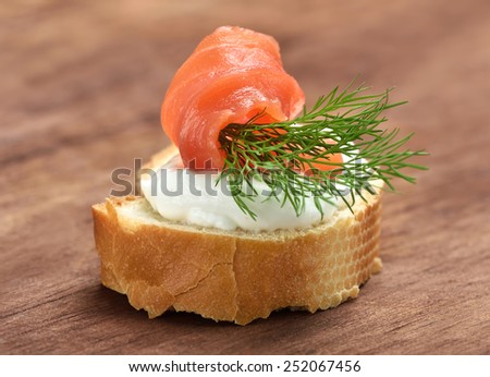Appetizer with salmon and dill, close up view