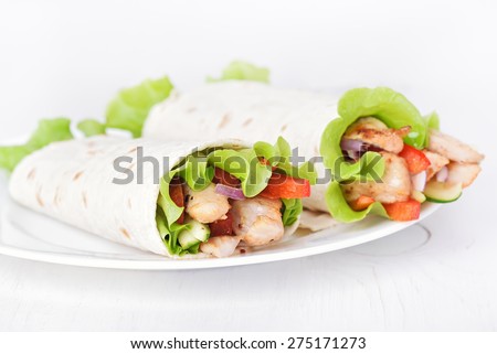 Wrap sandwiches with chicken meat and vegetables,close up view