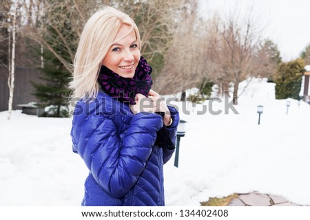 Beautiful girl in the park in winter