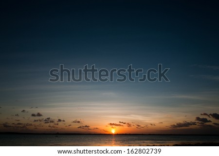 Beautiful sea sunset with sun and blue sky