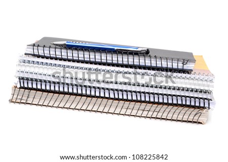 stacked notebooks white background