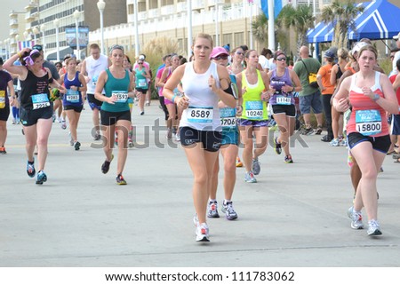 VIRGINIA BEACH, VIRGINIA-SEPTEMBER 2: Runners compete in the Rock N Roll Half Marathon on September 2, 2012 in Virginia Beach, Virginia