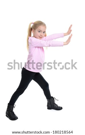little girl with arms extended in front pushing motion
