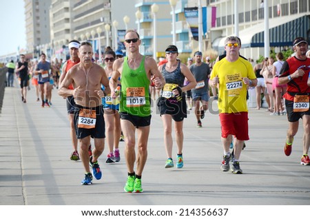 VIRGINIA BEACH, VIRGINIA - AUGUST 31: Runners compete in the Rock N Roll Virginia Beach 1/2 Marathon in Virginia Beach, Virginia August 31, 2014