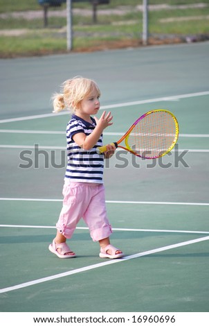 toddler learning tennis