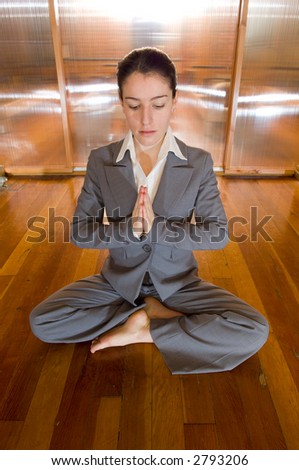 Business woman in prayer pose
