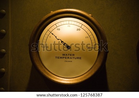Water temperature gauge on rusty vintage steel