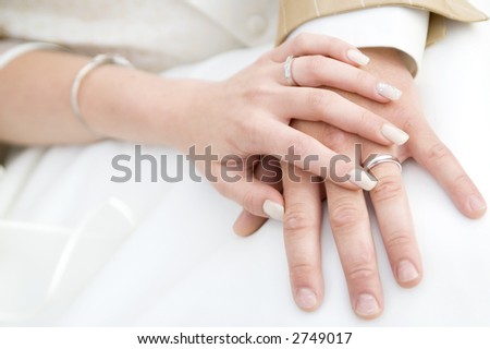 stock photo Weddings rings and holding hands