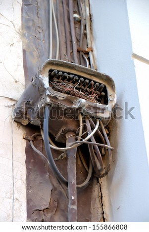 old ailing power cord to a wall