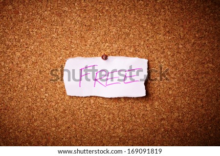 Free - sign pinned on a cork pin wall
