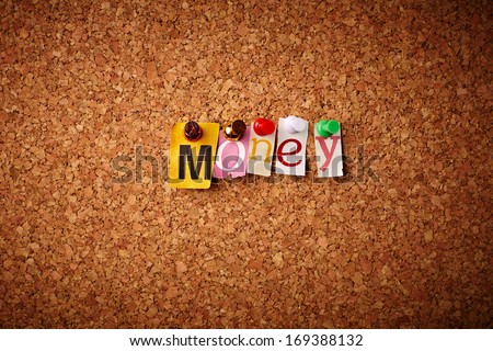 Money   - Cut out letters pinned on a cork notice board.