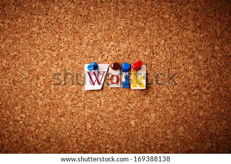 Work   - Cut out letters pinned on a cork notice board.