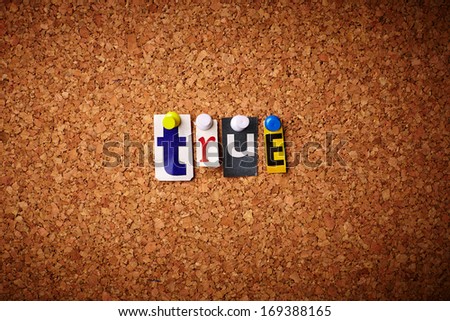 True   - Cut out letters pinned on a cork notice board.