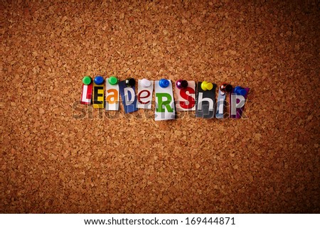 Leadership - Cut out letters pinned on a cork notice board.