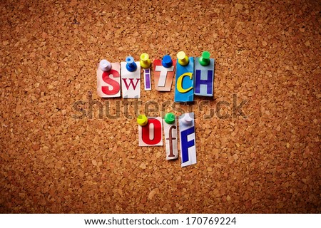 Switch Off  - Cut out letters pinned on a notice board.