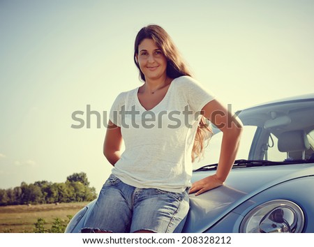 Car Woman - Young cheerful Woman standing in front of her new car, rental car smiling looking into camera.