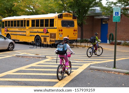 Elementary school students bike to school on International Walk and Bike to School Day