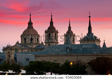 San Lorenzo de El Escorial Monastery  with beautiful sky right after sunset. Four towers are set off by sky with pink and purple hues.