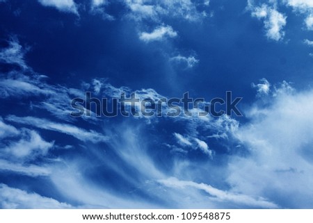 blue abstract background, dark blue sky with white clouds as atmosphere water vapor condensation