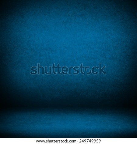interior wall background suede paper texture in blue color and shadow vignette in the corners