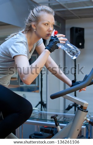 Woman drink water in gym