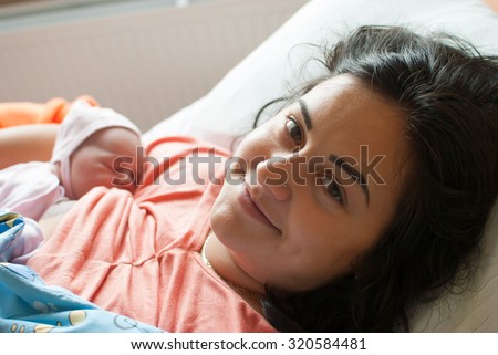 Mother with a new born baby in hospital