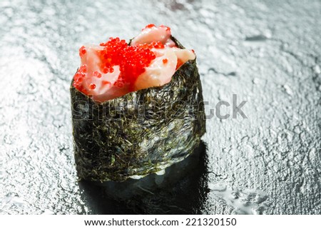 Japanese Cuisine - Sushi Roll with Tuna, Salmon, Conger and Flying Fish Roe