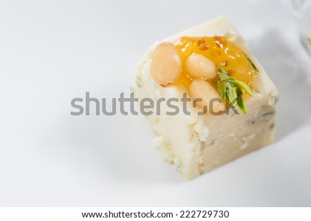 Appetizer. Blue cheese with nuts. Creative cuisine. close-up