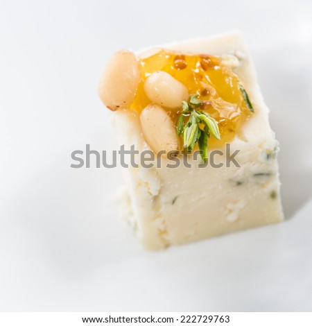 Appetizer. Blue cheese with nuts. Creative cuisine. close-up