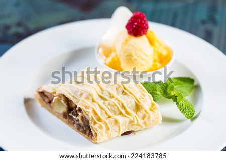 Apple strudel with icing sugar,almonds and vanilla ice cream for Christmas