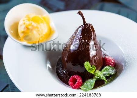 pears in the chocolate. Creative cuisine. Dessert. selective Focus