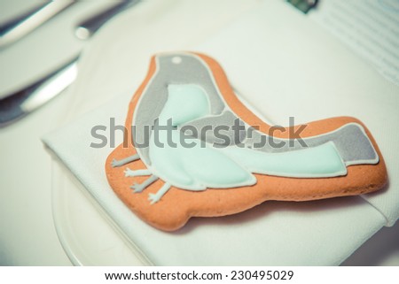 Cookies bird on plate. Decorations for wedding day
