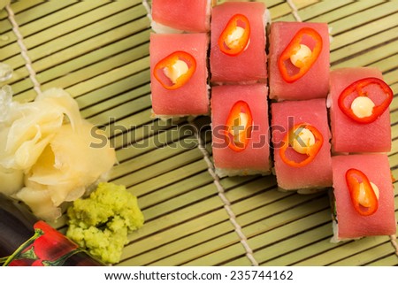 Maki Sushi. Roll with Cucumber and Cream Cheese inside. Topped with Tuna