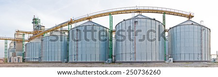 Ukraine, Odessa - AUGUST 2, 2014: Towers of grain drying enterprise. metal grain facility with silos