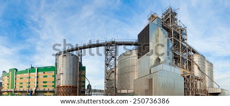 Ukraine, Odessa - AUGUST 2, 2014: Towers of grain drying enterprise. metal grain facility with silos