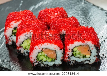 Japanese Cuisine - Sushi Roll with Tuna, Salmon, Conger and Flying Fish Roe