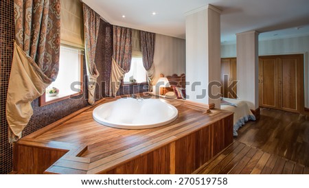 luxury bathroom interior complete with granite and beautiful tiled floors and walls.