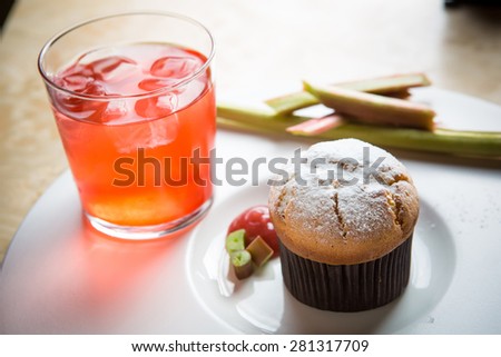 Rhubarb and ginger muffins on white plate