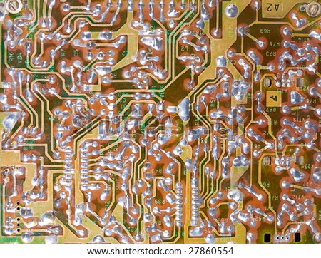 Macro picture of an old electronic board with chips and other electronics components