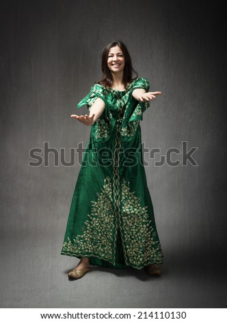 girl with african dress dancing macarena
