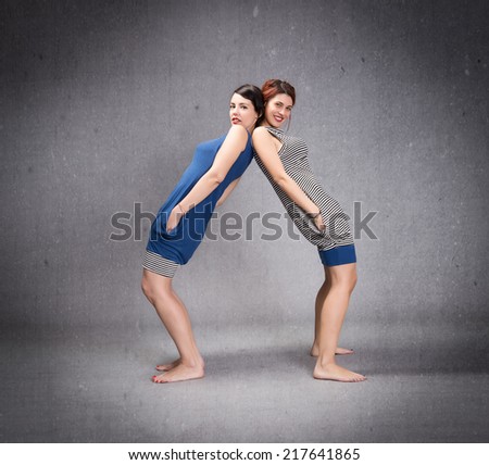couple of friend standing in a strange position