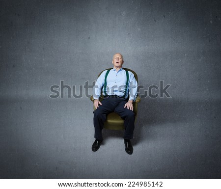 senior male sleeping on sofa